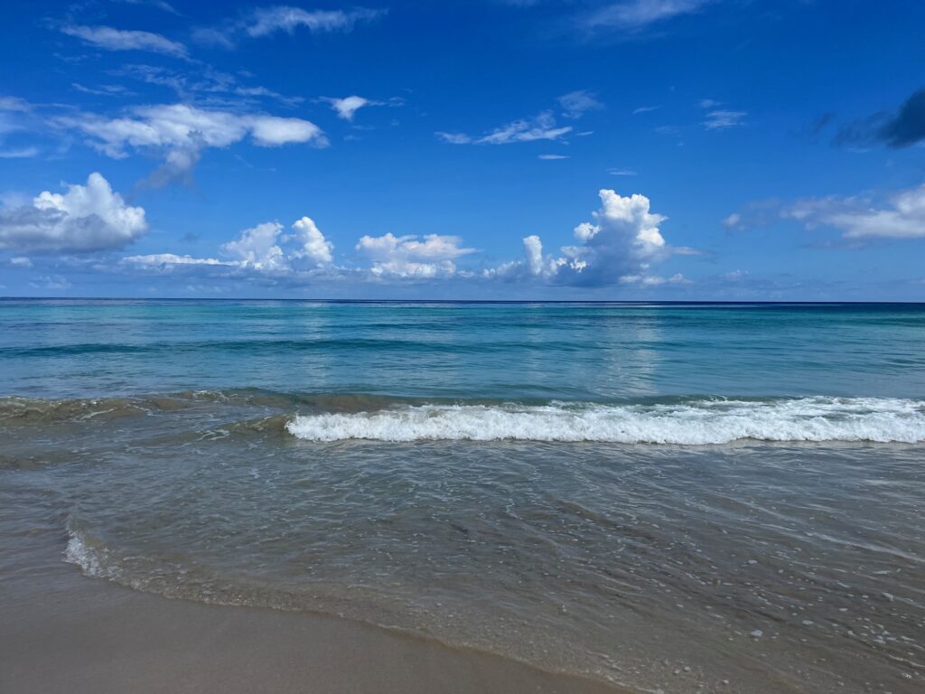 Calm crystal clear ocean water with small waves