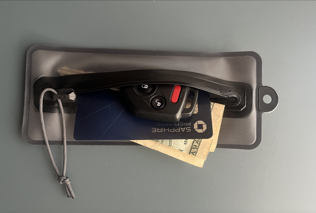 Pouch for key, cash, and cards keeps dry